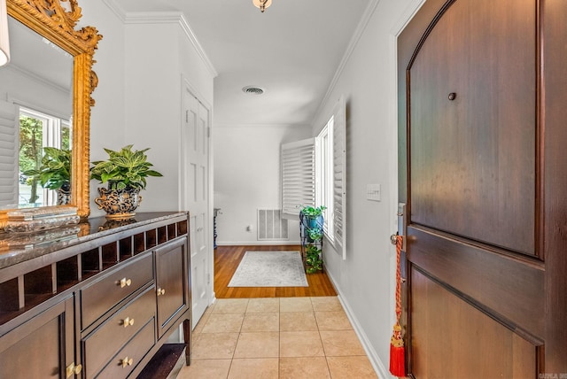 5412 S Grandview St, Little Rock, AR 72207 - entrance foyer with crown molding, light tile patterned floors, and baseboards