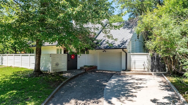 5412 S Grandview St, Little Rock, AR 72207 - view of front facade featuring driveway, a shingled roof, and brick siding