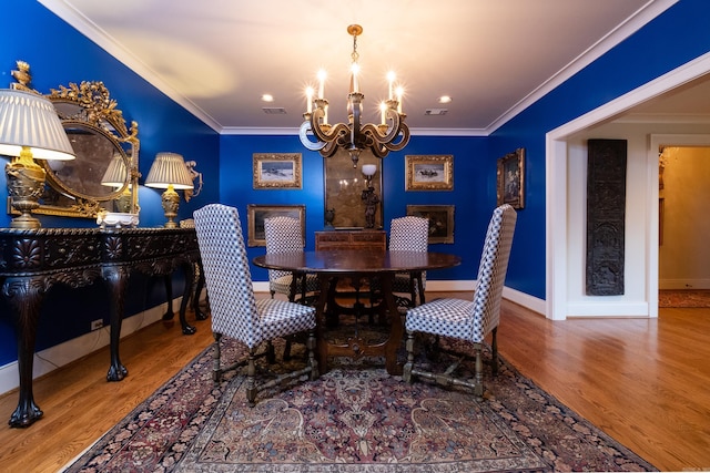 5313 N Grandview St, Little Rock, AR 72207 - dining area featuring a chandelier, wood finished floors, ornamental molding, baseboards, and recessed lighting
