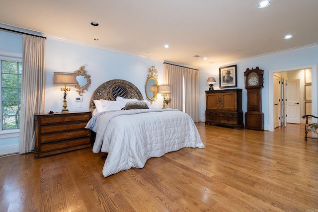 5313 N Grandview St, Little Rock, AR 72207 - bedroom with light wood finished floors, crown molding, and recessed lighting