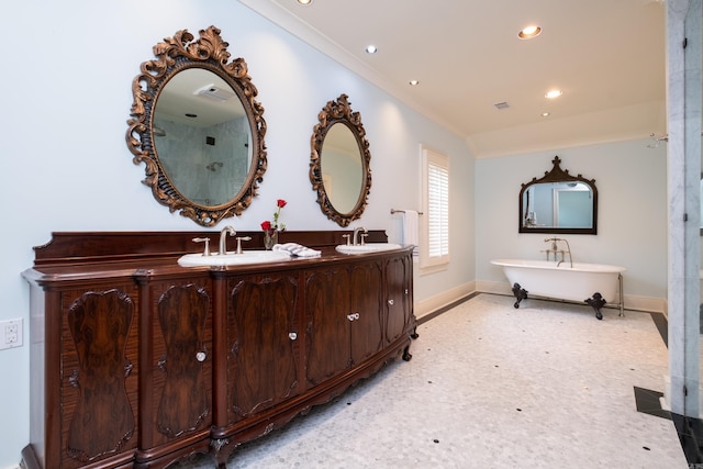 5313 N Grandview St, Little Rock, AR 72207 - full bath featuring baseboards, double vanity, ornamental molding, a soaking tub, and recessed lighting