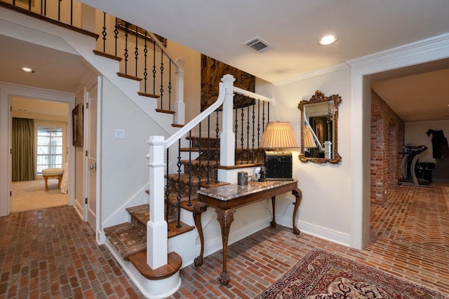 5313 N Grandview St, Little Rock, AR 72207 - stairs featuring baseboards, brick floors, crown molding, and recessed lighting