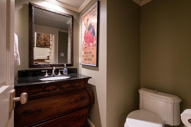 5313 N Grandview St, Little Rock, AR 72207 - half bathroom featuring toilet, crown molding, vanity, and baseboards