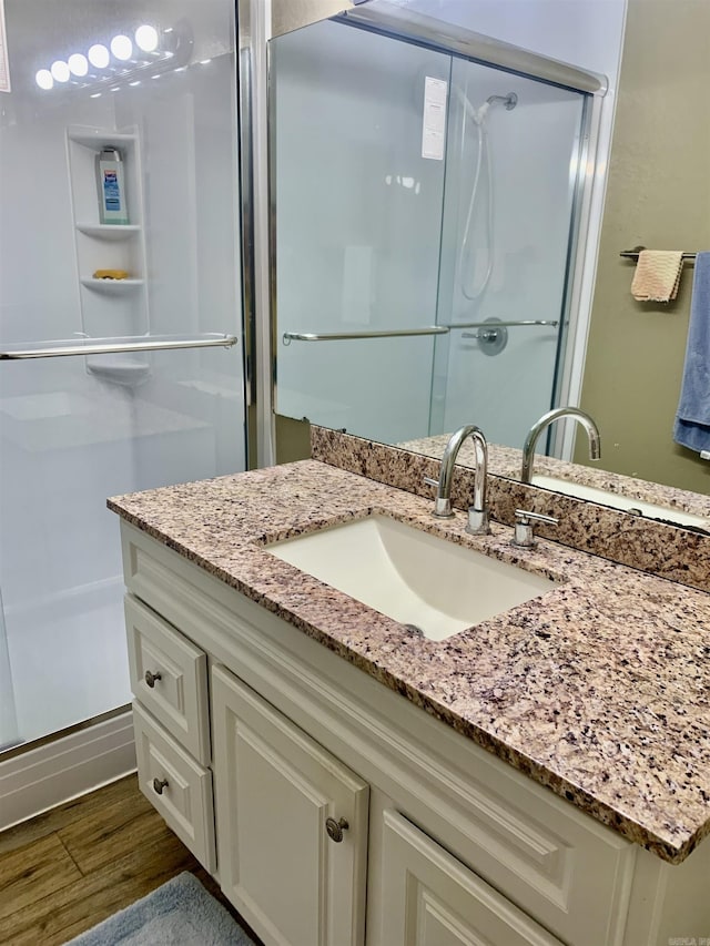 5405 Dreher Ln, Little Rock, AR 72209 - bathroom featuring vanity, a stall shower, and wood finished floors