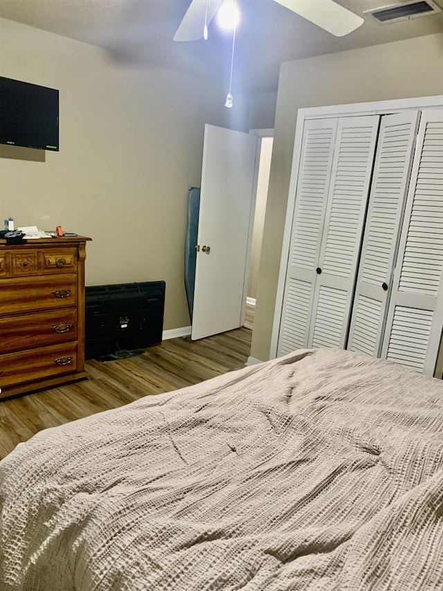 5405 Dreher Ln, Little Rock, AR 72209 - bedroom with wood finished floors, a closet, ceiling fan, and baseboards
