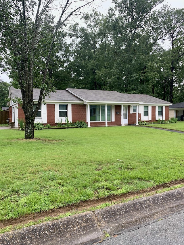 5405 Dreher Ln, Little Rock, AR 72209 - ranch-style home with a front yard and brick siding