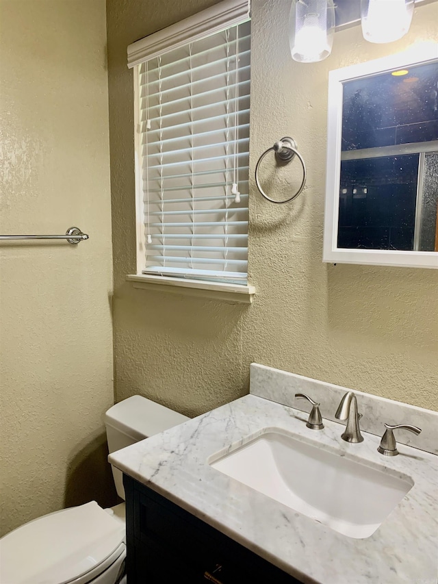 5405 Dreher Ln, Little Rock, AR 72209 - half bath featuring toilet, vanity, and a textured wall