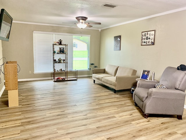 5405 Dreher Ln, Little Rock, AR 72209 - living area with crown molding, ceiling fan, light wood-type flooring, baseboards, and a textured ceiling
