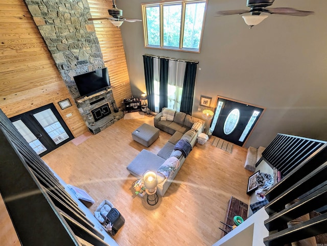 149 Polk Rd Unit 714, Mena, AR 71953 - living room featuring ceiling fan, a towering ceiling, wood finished floors, and a fireplace