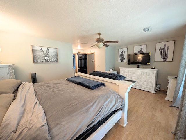 149 Polk Rd Unit 714, Mena, AR 71953 - bedroom featuring light wood-type flooring, ceiling fan, and baseboards