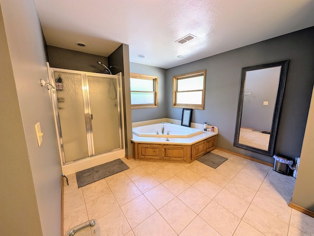 149 Polk Rd Unit 714, Mena, AR 71953 - full bathroom featuring a stall shower, a bath, tile patterned floors, and a textured ceiling