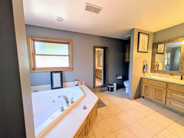 149 Polk Rd Unit 714, Mena, AR 71953 - full bathroom featuring vanity, a tub with jets, toilet, and tile patterned floors