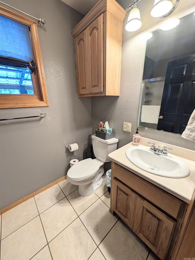 149 Polk Rd Unit 714, Mena, AR 71953 - full bath featuring toilet, vanity, tile patterned floors, a shower with door, and baseboards