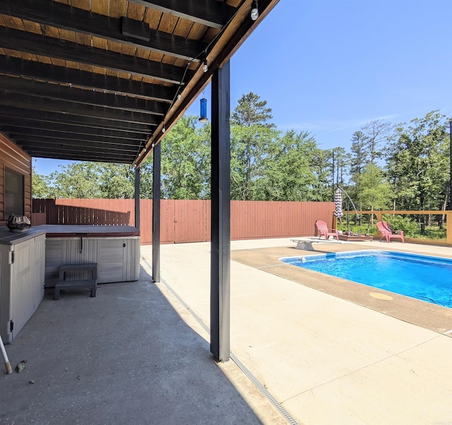 149 Polk Rd Unit 714, Mena, AR 71953 - view of swimming pool featuring a patio, a fenced backyard, a hot tub, and a diving board