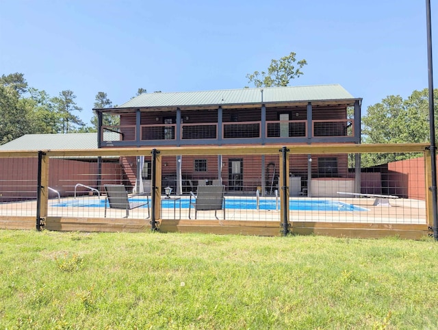 149 Polk Rd Unit 714, Mena, AR 71953 - rear view of house featuring a patio and metal roof