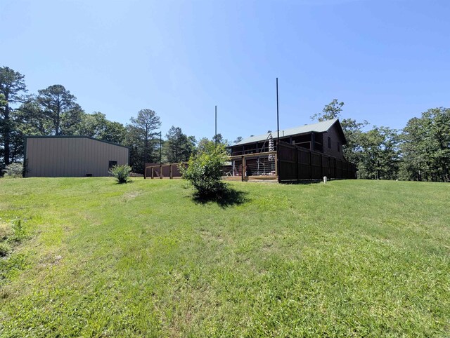 149 Polk Rd Unit 714, Mena, AR 71953 - view of grassy yard featuring an outbuilding and an outdoor structure
