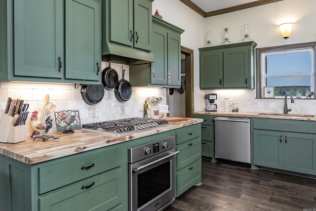 410 Rocky Point Rd, Vilonia, AR 72173 - kitchen featuring appliances with stainless steel finishes, green cabinets, a sink, butcher block countertops, and ornamental molding
