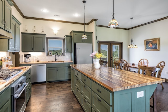 410 Rocky Point Rd, Vilonia, AR 72173 - kitchen with wood counters, appliances with stainless steel finishes, green cabinets, a sink, and crown molding
