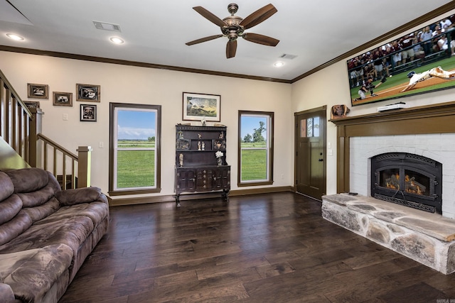 410 Rocky Point Rd, Vilonia, AR 72173 - living room with ornamental molding, a ceiling fan, a fireplace, stairway, and wood finished floors