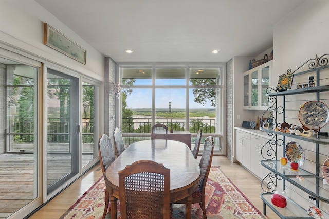 8 River View Pt, Little Rock, AR 72227 - dining room with a water view, light wood-type flooring, and recessed lighting