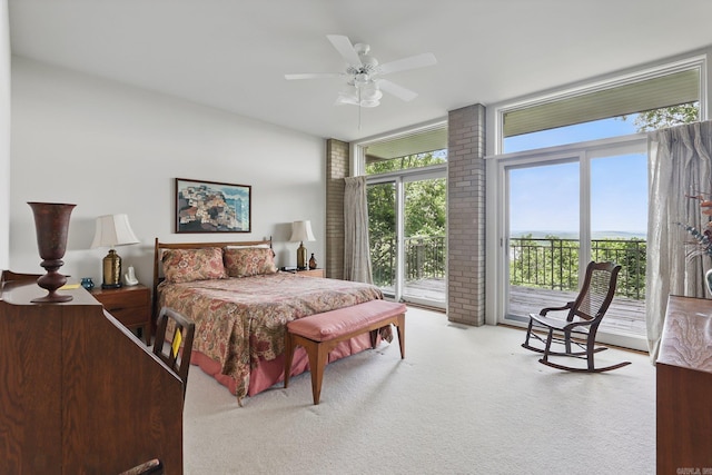 8 River View Pt, Little Rock, AR 72227 - carpeted bedroom with access to exterior, multiple windows, and a ceiling fan