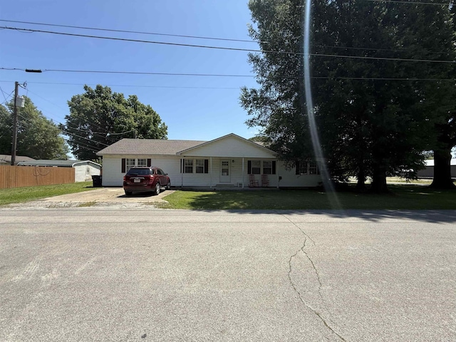 221 N Garfield Ave, Piggott, AR 72454 - view of front of property featuring covered porch and driveway