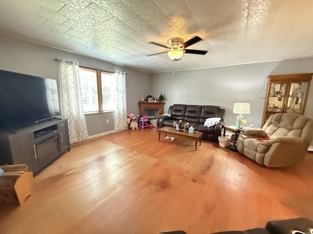 221 N Garfield Ave, Piggott, AR 72454 - living room with light wood-style flooring and a ceiling fan
