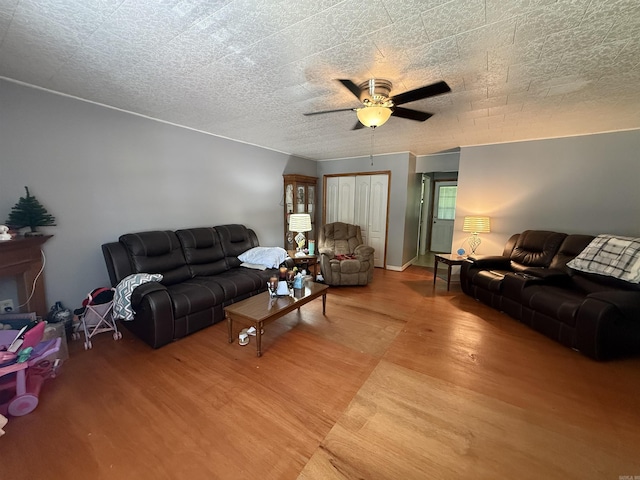 221 N Garfield Ave, Piggott, AR 72454 - living room with wood finished floors and a ceiling fan