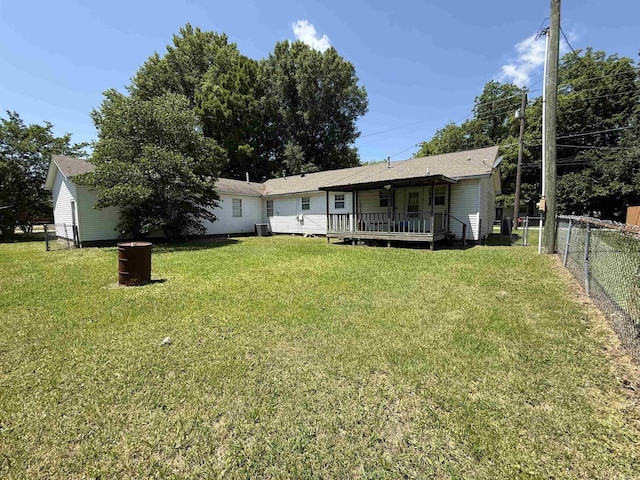 221 N Garfield Ave, Piggott, AR 72454 - rear view of property featuring a deck