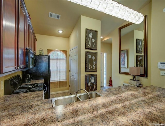 321 Peters Pt, Hot Springs, AR 71913 - kitchen featuring a sink, black appliances, and light stone countertops