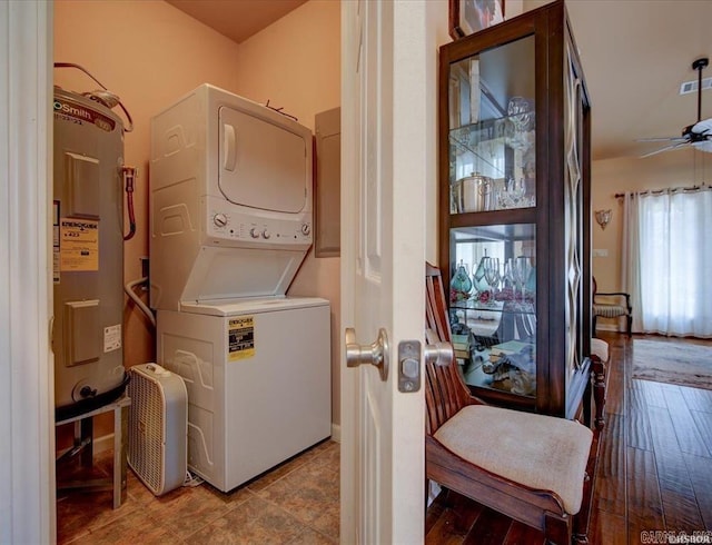 321 Peters Pt, Hot Springs, AR 71913 - laundry room featuring stacked washer and clothes dryer, water heater, and a ceiling fan