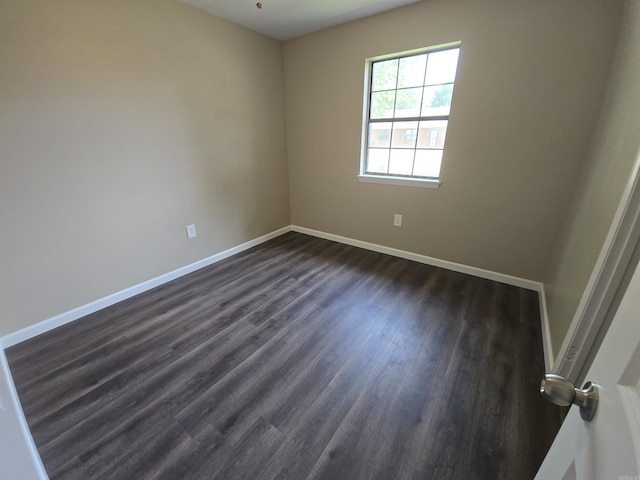 311 Ce Brawner Rd, Wynne, AR 72396 - unfurnished room with dark wood-style floors and baseboards