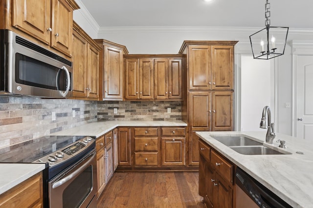 5400 Montgomery Rd, Little Rock, AR 72223 - kitchen featuring appliances with stainless steel finishes, a sink, brown cabinetry, dark wood-type flooring, and crown molding