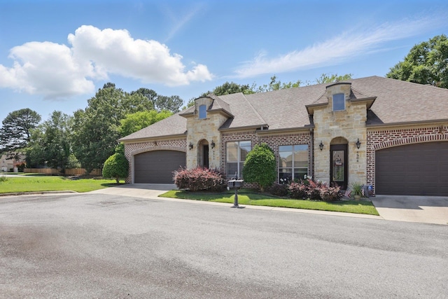 5400 Montgomery Rd, Little Rock, AR 72223 - french provincial home with stone siding, a garage, roof with shingles, and a front yard