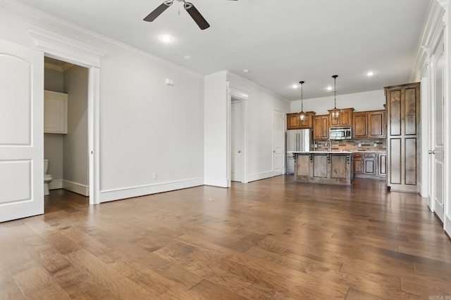 5400 Montgomery Rd, Little Rock, AR 72223 - unfurnished living room featuring ceiling fan, baseboards, dark wood-type flooring, recessed lighting, and crown molding