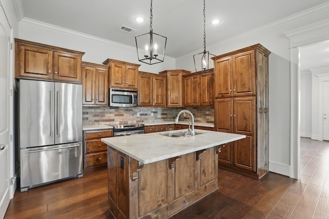 5400 Montgomery Rd, Little Rock, AR 72223 - kitchen with stainless steel appliances, a sink, brown cabinetry, light countertops, and dark wood-type flooring