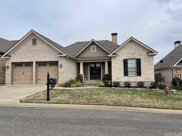 904 Brisbane, Searcy, AR 72143 - craftsman house with an attached garage, a front lawn, brick siding, driveway, and french doors