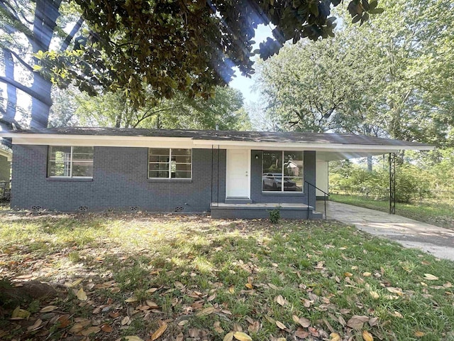 3003 Hollywood St, Texarkana, TX 75503 - view of front of home with concrete driveway, brick siding, a carport, and crawl space