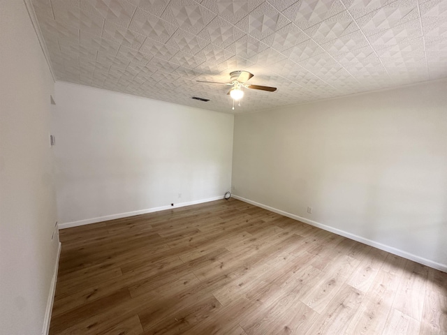 3003 Hollywood St, Texarkana, TX 75503 - spare room featuring ceiling fan, baseboards, and wood finished floors