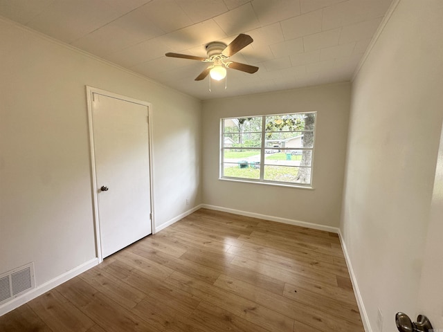 3003 Hollywood St, Texarkana, TX 75503 - spare room with ornamental molding, ceiling fan, wood finished floors, and baseboards