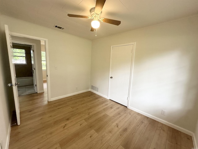 3003 Hollywood St, Texarkana, TX 75503 - unfurnished room featuring crown molding, light wood-style flooring, a ceiling fan, and baseboards