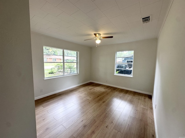 3003 Hollywood St, Texarkana, TX 75503 - spare room featuring ceiling fan, wood-type flooring, baseboards, and ornamental molding