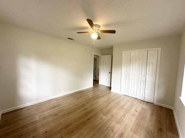 3003 Hollywood St, Texarkana, TX 75503 - unfurnished bedroom featuring wood finished floors, baseboards, a closet, and ceiling fan