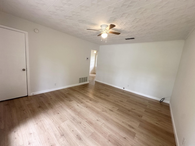 3003 Hollywood St, Texarkana, TX 75503 - empty room with ceiling fan, baseboards, and wood finished floors