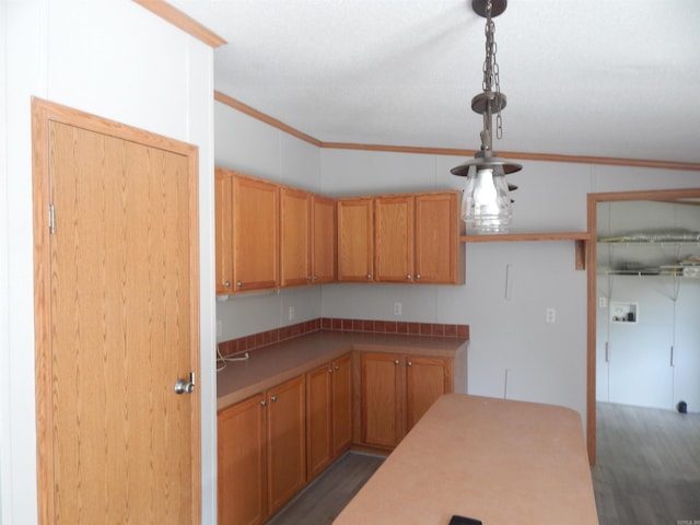 505 Main, West Point, AR 72178 - kitchen with dark wood finished floors, ornamental molding, and decorative light fixtures