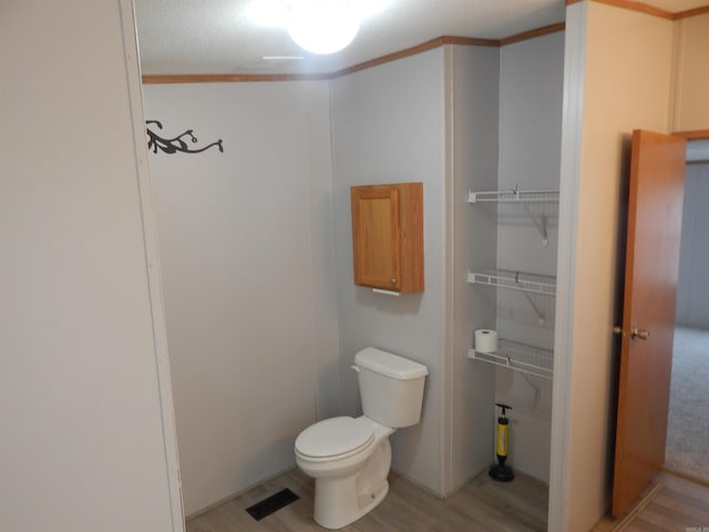505 Main, West Point, AR 72178 - bathroom with toilet and wood finished floors