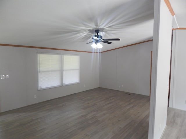 505 Main, West Point, AR 72178 - empty room featuring wood finished floors, ornamental molding, and ceiling fan