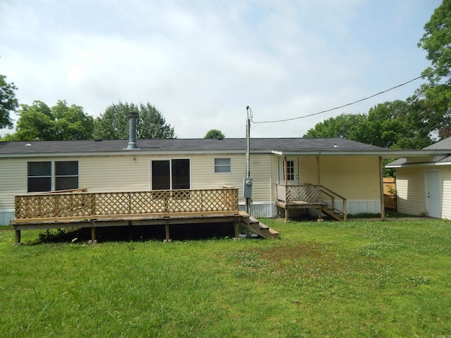 505 Main, West Point, AR 72178 - back of house with a lawn and a deck