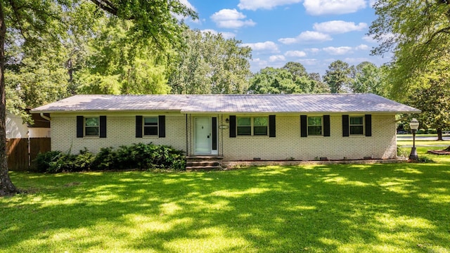 7110 Forest Dale Dr, North Little Rock, AR 72118 - ranch-style home featuring brick siding, a front yard, and metal roof