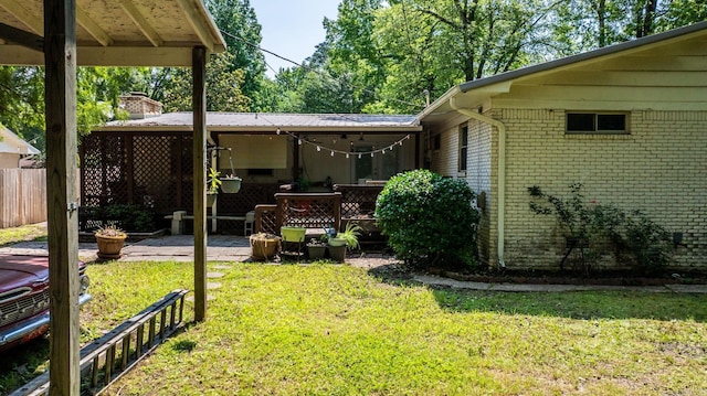 7110 Forest Dale Dr, North Little Rock, AR 72118 - rear view of house with brick siding, a patio area, and a chimney